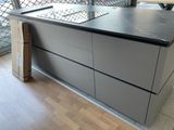 an image of a kitchen with a counter top and drawers