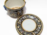 a cup and saucer sitting next to each other on a table