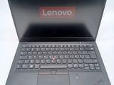 a laptop that has a lenovo logo on the screen