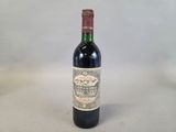 a bottle of wine that is sitting on a table