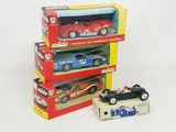 three toy cars that are stacked on top of each other