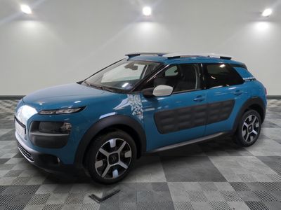 a blue citrole is parked on a checkered floor