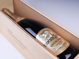 a bottle of wine in a wooden box on a table