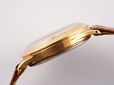 an image of a close up of a watch on a white surface