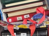 a bag full of books sitting on top of a table