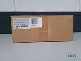an empty box sitting on top of a table with a barcode on it