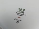a white plate with a black and red design on it
