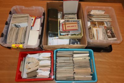 a lot of boxes of books and papers on the table