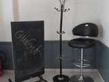 a chalk board and a chair in a room