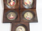 four miniature portraits of women in wooden frames on a white surface