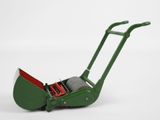 a close up of a green lawn mower on a white background