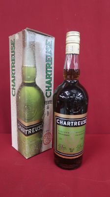 a bottle of charreuse next to a box of charreuse