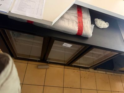a bathroom with a sink and a towel on the counter