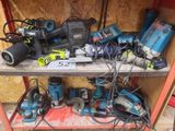 many tools on a shelf in a garage