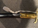 a knife that is laying on top of a carpet