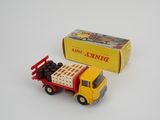yellow and red toy truck with a box of chocolates on the back