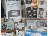 plusieurs photos de produits pour bébés présentés dans des boîtes posées sur une table