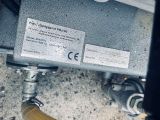a close up view of a hose connected to a water heater