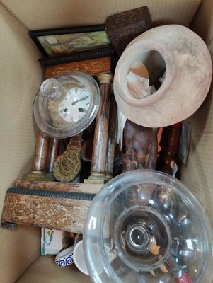 a box full of assorted items including a clock