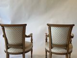 pair of antique chairs with upholstered back and arms