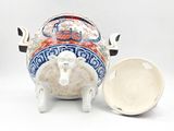 an image of a ceramic pig with a lid
