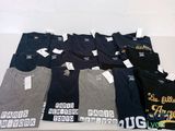 a lot of t - shirts that are on a table