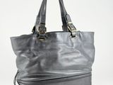 a black leather tote bag on a white background