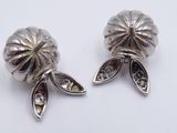 pair of silver tone flower earrings with clear crystal stones