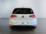 the back of a white volkswagen vw golf parked in a garage