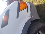 a truck that has a tire on top of it