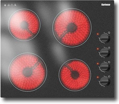 a picture of a stove top with four burners and knobs
