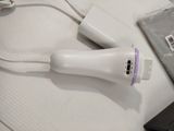 a wii remote and a charger on a table