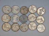 a close up of a bunch of coins on a table