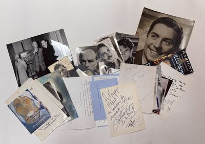 a lot of old photos and postcards on the table