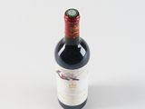 a bottle of wine that is sitting on a table