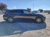 a picture of a black car parked in a parking lot