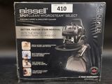 the box of the bissell spotclean hydrant cleaner is open