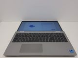 an open laptop computer sitting on top of a white table