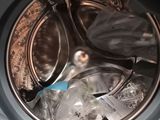 a close up of a washing machine with a lot of items inside of it