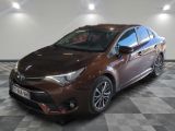 the toyota corollant is parked in a room with a checkered floor