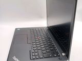 a laptop computer sitting on a table with a keyboard