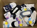 a cardboard box filled with various types of shoes
