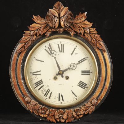 a clock that is sitting on a black surface
