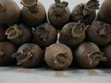 a pile of wooden vases sitting on top of a table