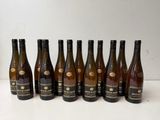 six bottles of wine lined up in a row on a table