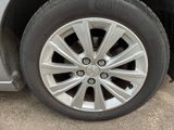a close up of a tire on a car ' s rim