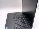a black laptop with a black keyboard on a white surface