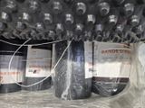 many rolls of black tape wrapped in plastic on top of each other