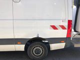 an image of a white van parked in a parking lot