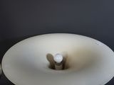 a white lamp that is on a table in a room